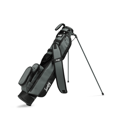 A full front shot of standing Loma golf bag in midnight green with single strap